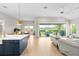 Spacious living room with sliding glass doors leading to backyard at 6189 Hidden Branch Dr, Apollo Beach, FL 33572