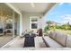 Relaxing patio featuring a seating area and access to the backyard at 6189 Hidden Branch Dr, Apollo Beach, FL 33572