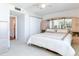 Primary bedroom with mirrored wardrobe and ceiling fan at 660 Island Way # 1005, Clearwater Beach, FL 33767