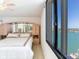 Bedroom with water view and mirrored wardrobe at 660 Island Way # 1005, Clearwater Beach, FL 33767