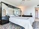 Spacious bedroom with mirrored wardrobe and ceiling fan at 660 Island Way # 1005, Clearwater Beach, FL 33767