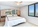Bedroom with water view and built-in mirrored wardrobe at 660 Island Way # 1005, Clearwater Beach, FL 33767