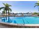 Relaxing kidney-shaped pool with ample space for sunbathing at 660 Island Way # 1005, Clearwater Beach, FL 33767