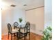 Bright dining area with glass table and four chairs at 660 Island Way # 1005, Clearwater Beach, FL 33767