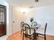 Small dining area with round table and four chairs at 660 Island Way # 1005, Clearwater Beach, FL 33767