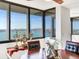 Elegant dining room with a round table and stunning water views at 660 Island Way # 1005, Clearwater Beach, FL 33767