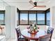 Bright dining area with water views and seating for four at 660 Island Way # 1005, Clearwater Beach, FL 33767