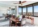 Elegant dining room with a round table, bay window, and water views at 660 Island Way # 1005, Clearwater Beach, FL 33767