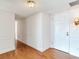 Light and airy entryway with hardwood floors and white wainscoting at 660 Island Way # 1005, Clearwater Beach, FL 33767