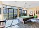 Game room with pool table and plenty of natural light at 660 Island Way # 1005, Clearwater Beach, FL 33767