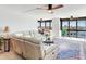 Spacious living room with water views and sectional sofa at 660 Island Way # 1005, Clearwater Beach, FL 33767