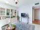 Living room with TV and built-in shelving at 660 Island Way # 1005, Clearwater Beach, FL 33767