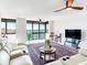 Living room with water views and white sofa at 660 Island Way # 1005, Clearwater Beach, FL 33767