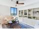 Living room with water views, comfy seating, and built-in shelving at 660 Island Way # 1005, Clearwater Beach, FL 33767