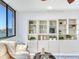 Living room with water views and built-in shelving at 660 Island Way # 1005, Clearwater Beach, FL 33767