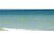 Clear, calm ocean water with small waves at 660 Island Way # 1005, Clearwater Beach, FL 33767