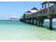 Pier over the ocean with people and birds at 660 Island Way # 1005, Clearwater Beach, FL 33767
