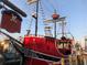 Red pirate ship named Pirates Ransom at a dock at 660 Island Way # 1005, Clearwater Beach, FL 33767
