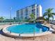 Community pool with tennis courts nearby at 660 Island Way # 1005, Clearwater Beach, FL 33767