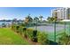 Well-maintained tennis court with surrounding hedges at 660 Island Way # 1005, Clearwater Beach, FL 33767