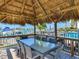Covered patio area with seating and waterfront views at 660 Island Way # 1005, Clearwater Beach, FL 33767