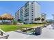 Community boardwalk and lush green space by the water at 660 Island Way # 1005, Clearwater Beach, FL 33767