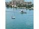 Sailboat and motorboat on calm waterway near condos at 660 Island Way # 1005, Clearwater Beach, FL 33767