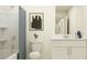 Clean bathroom with a shower/tub combo, white vanity, and a modern design at 9232 Bonita Mar Dr, Parrish, FL 34219