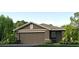 One story home with brown siding, two car garage, and landscaping at 10256 Kalamazoo Pl, Parrish, FL 34219
