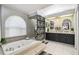 Spa-like bathroom with soaking tub and double vanity at 10277 Rosetti Ct, Spring Hill, FL 34608