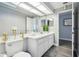 Bathroom with white vanity, marble countertop, and toilet at 10277 Rosetti Ct, Spring Hill, FL 34608