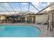 Enjoy this refreshing pool with covered patio and comfortable seating at 10277 Rosetti Ct, Spring Hill, FL 34608