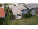 Aerial view of home with pool and lush landscaping at 10626 Restoration Ter, Bradenton, FL 34212