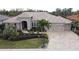 Luxury home with tile roof and three-car garage at 10626 Restoration Ter, Bradenton, FL 34212