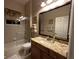 Well-appointed bathroom with granite countertops and a soaking tub at 10626 Restoration Ter, Bradenton, FL 34212