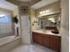 Spa-like bathroom with a soaking tub and updated fixtures at 10626 Restoration Ter, Bradenton, FL 34212