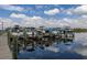 Community boat docks with multiple boats reflecting in the water at 10626 Restoration Ter, Bradenton, FL 34212