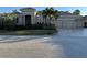 Stunning two-story home with three-car garage and manicured landscaping at 10626 Restoration Ter, Bradenton, FL 34212