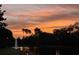 Sunset over a tranquil lake with fountain at 10626 Restoration Ter, Bradenton, FL 34212