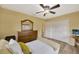 Bedroom with a bed, dresser, and ceiling fan at 11019 Hannaway Dr, Riverview, FL 33578