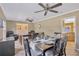 Bright dining room features a table with seating for six and access to kitchen at 11019 Hannaway Dr, Riverview, FL 33578