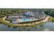 Resort-style community pool and clubhouse with surrounding landscape at 1116 Flora Vista St, Trinity, FL 34655