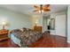 Large bedroom with hardwood floors and access to bathroom at 1116 Flora Vista St, Trinity, FL 34655