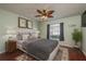 Spacious bedroom with hardwood floors, ceiling fan, and large window at 1116 Flora Vista St, Trinity, FL 34655