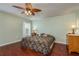 Spacious bedroom with hardwood floors and ceiling fan at 1116 Flora Vista St, Trinity, FL 34655