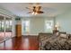 Main bedroom with hardwood floors and access to patio at 1116 Flora Vista St, Trinity, FL 34655