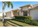 Brick front of house with two-car garage and well-maintained landscaping at 1116 Flora Vista St, Trinity, FL 34655