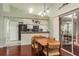 Eat-in kitchen with granite countertops and access to screened patio at 1116 Flora Vista St, Trinity, FL 34655