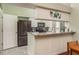 Kitchen boasts granite countertops and stainless steel appliances at 1116 Flora Vista St, Trinity, FL 34655