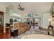 Open living space with hardwood floors, vaulted ceilings, and view of kitchen at 1116 Flora Vista St, Trinity, FL 34655